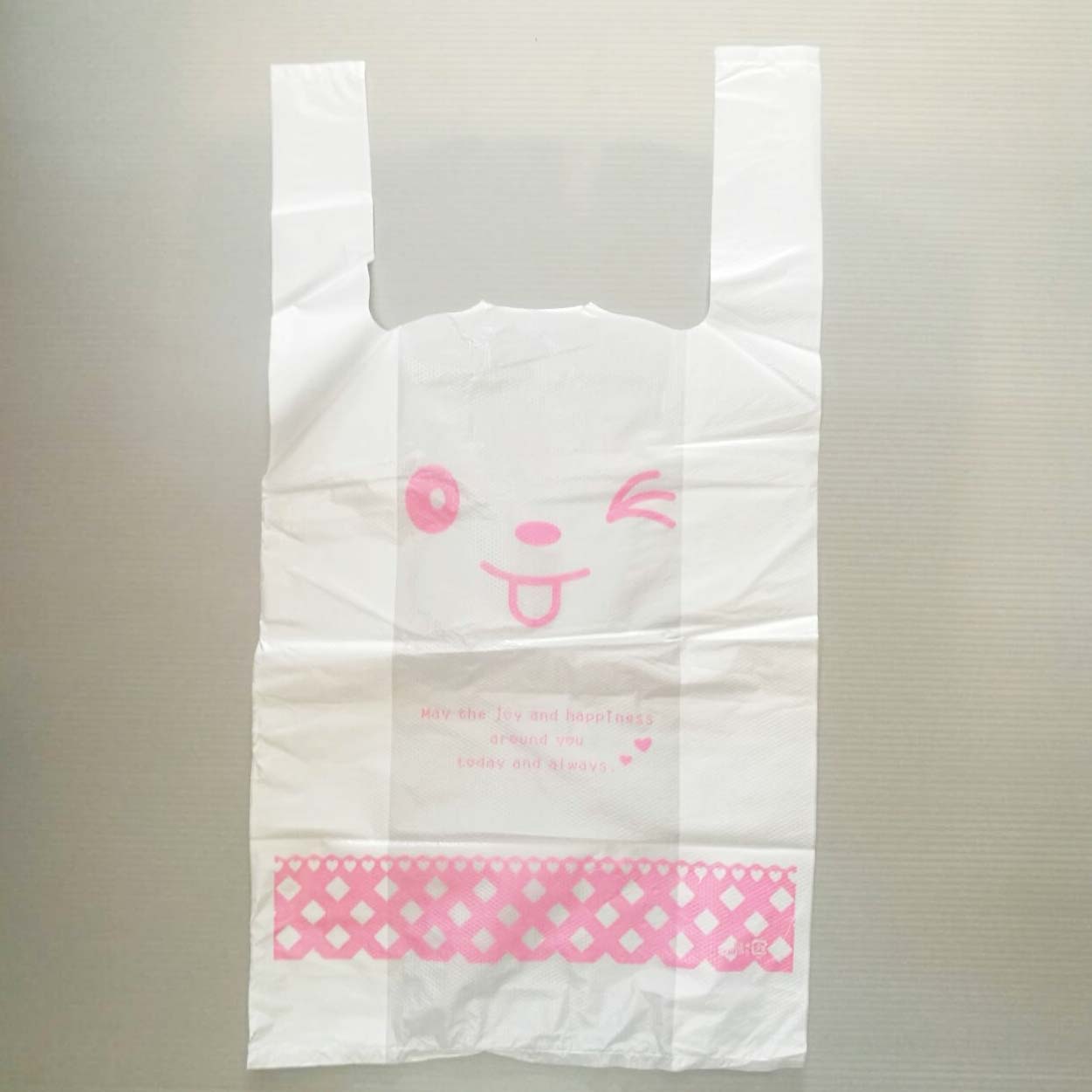 ถุงหูหิ้ว สีขาวลายหน้าการ์ตูนยิ้ม 23x43x11 cm. 100 ชิ้น