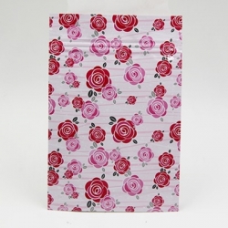 ซองซิปลายดอกกุหลาบสีแดงชมพูพื้นหลังสีขาว ขนาด 8x12 cm. 100 ชิ้น